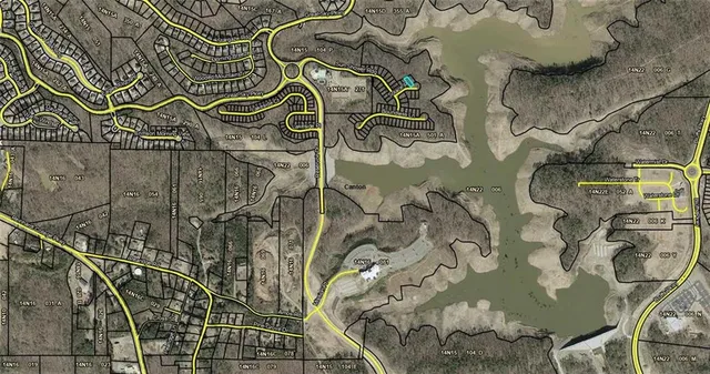 an aerial view of a house with outdoor space and a lake view