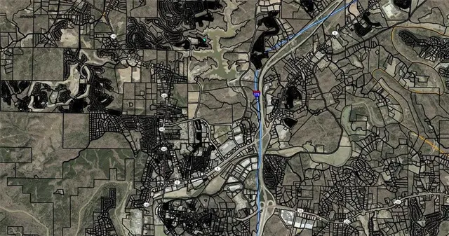 an aerial view of a house with outdoor space and lake view