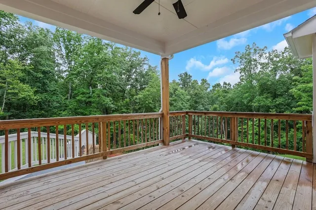 a view of a balcony with wooden floor