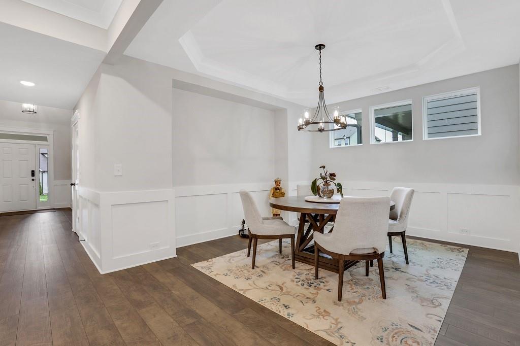 413 Solace Place Canton, GA 30114 - Photo 57 of 75 a view of a dining room with furniture window and wooden floor