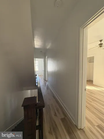 a view of gallery with wooden floor