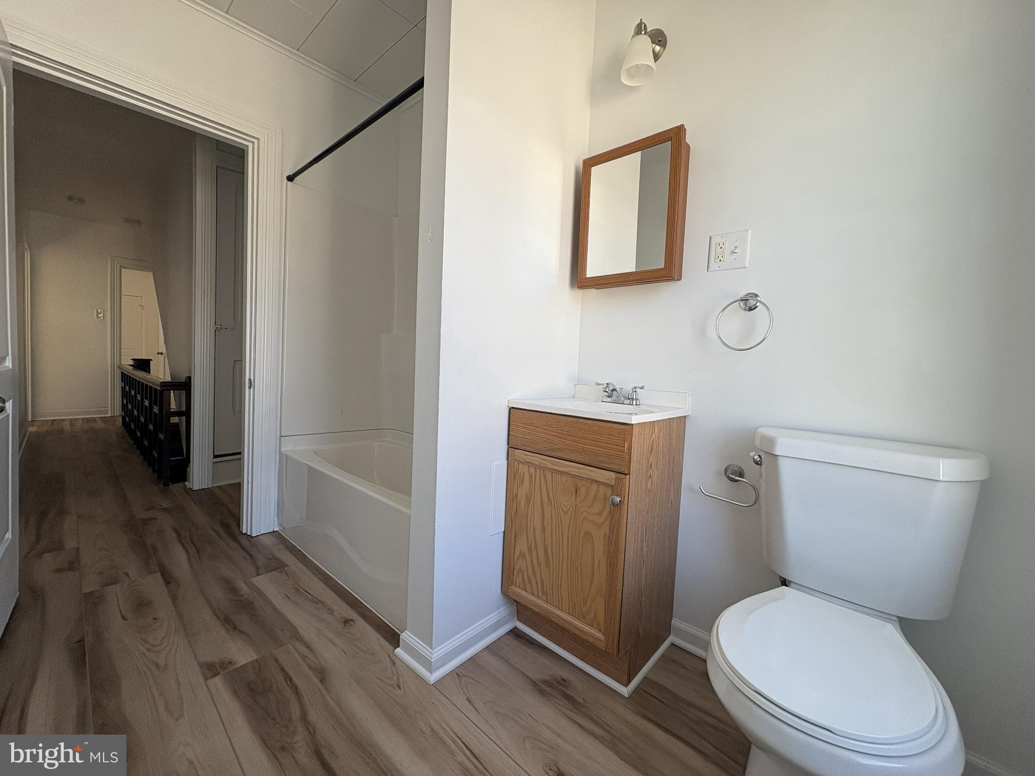 156 East Penn Street Carlisle, PA 17013 - Photo 16 of 17 a white toilet sitting next to a bathroom sink