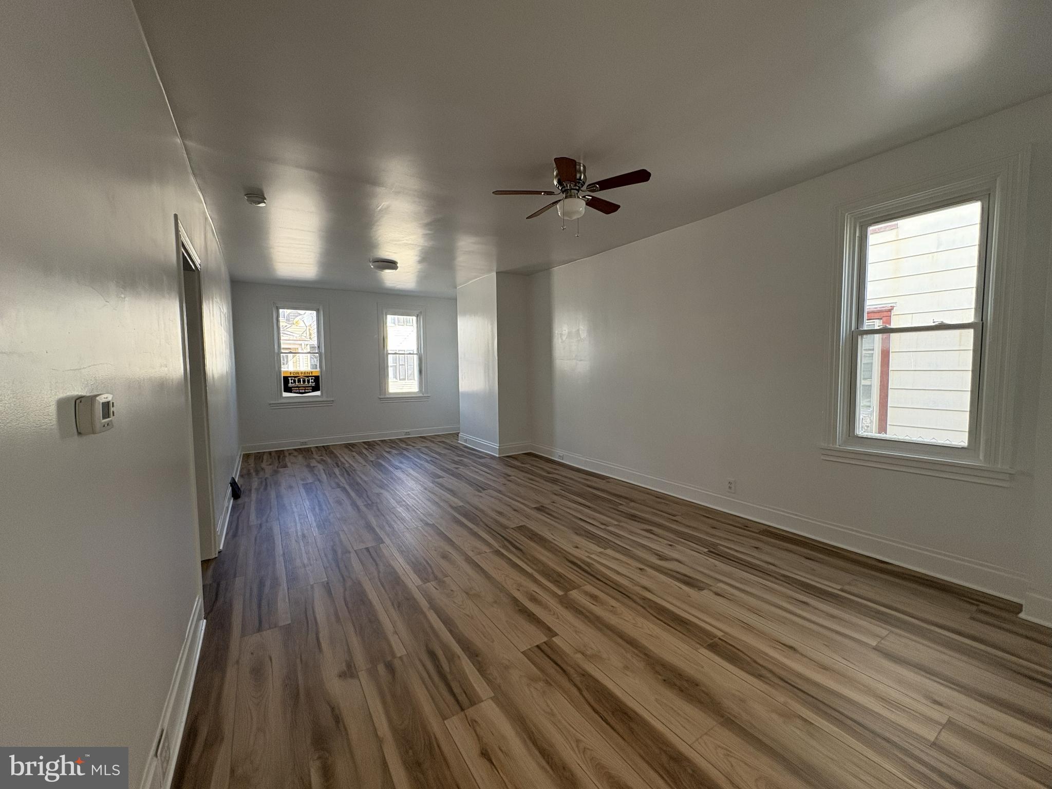 156 East Penn Street Carlisle, PA 17013 - Photo 4 of 17 a view of a room with wooden floors and window
