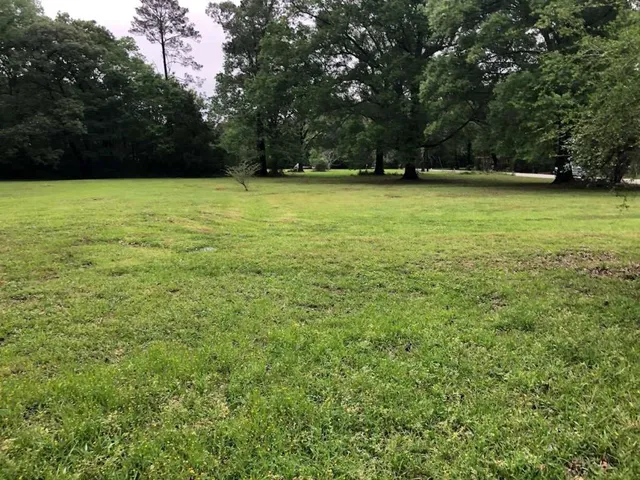 a view of a swimming pool with an outdoor space and seating area