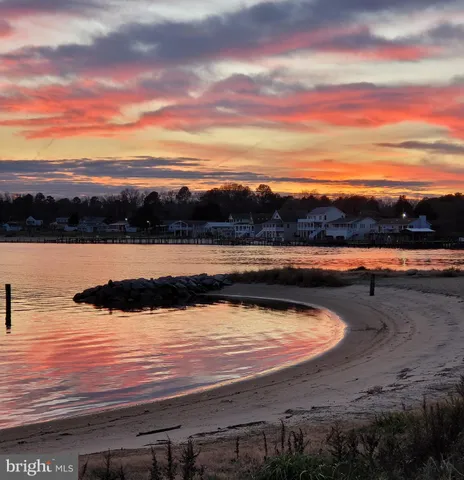 a view of swimming pool with a yard and sitting space