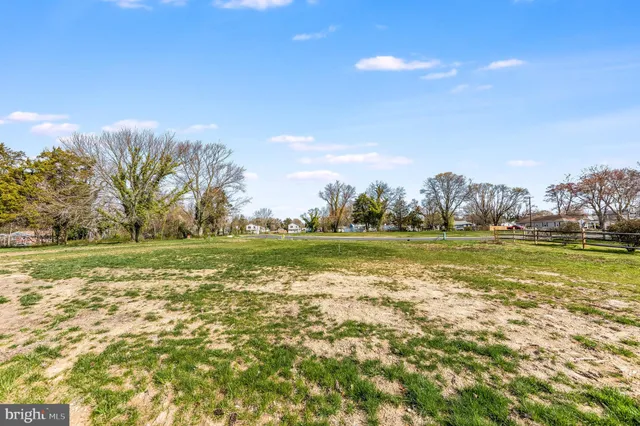 a view of a lake with houses in the background