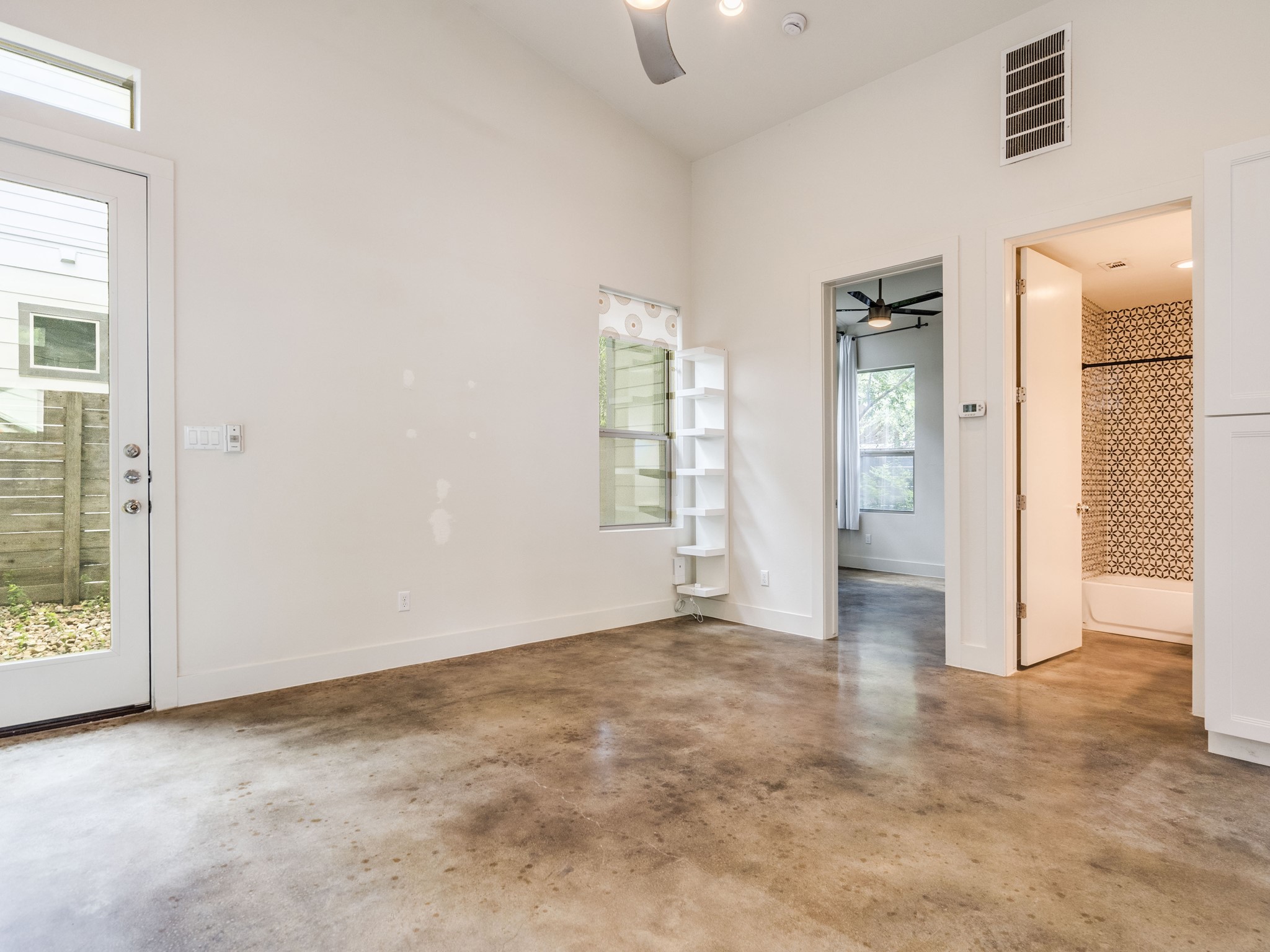 1404 Singleton Avenue, Unit B Austin, TX 78702 - Photo 9 of 21 Tall ceilings and polished concrete floors define this adaptable living space.