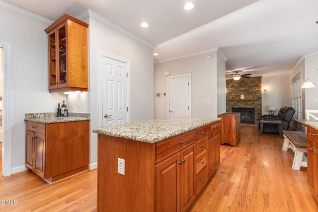 a living room with furniture rug and a window