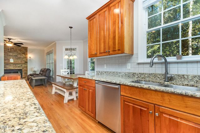 a view of a livingroom with furniture window and wooden floor