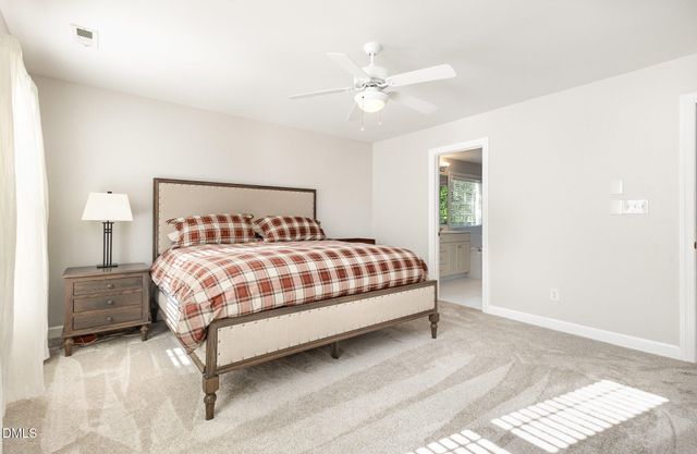 a view of walk in closet with clothes