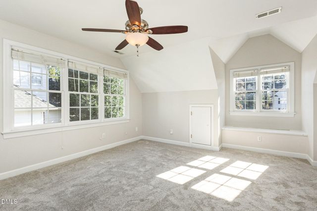a view of a patio with couches chairs and a fire pit