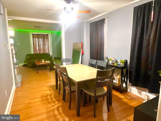 a view of a dining room with furniture and a chandelier