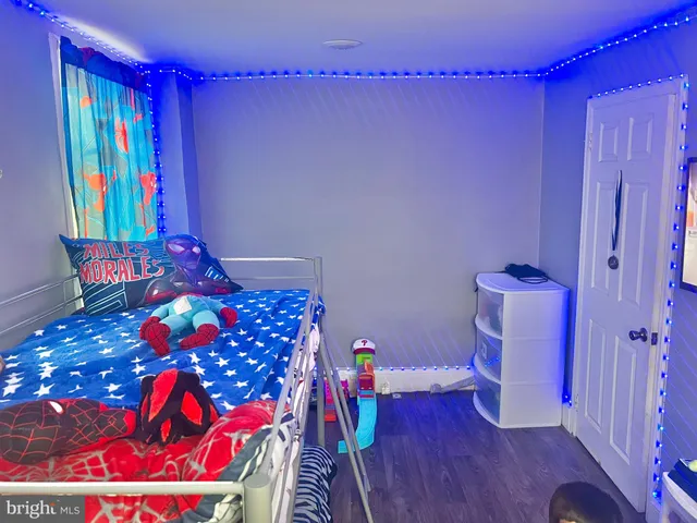 a bedroom with a bed and a bookshelf