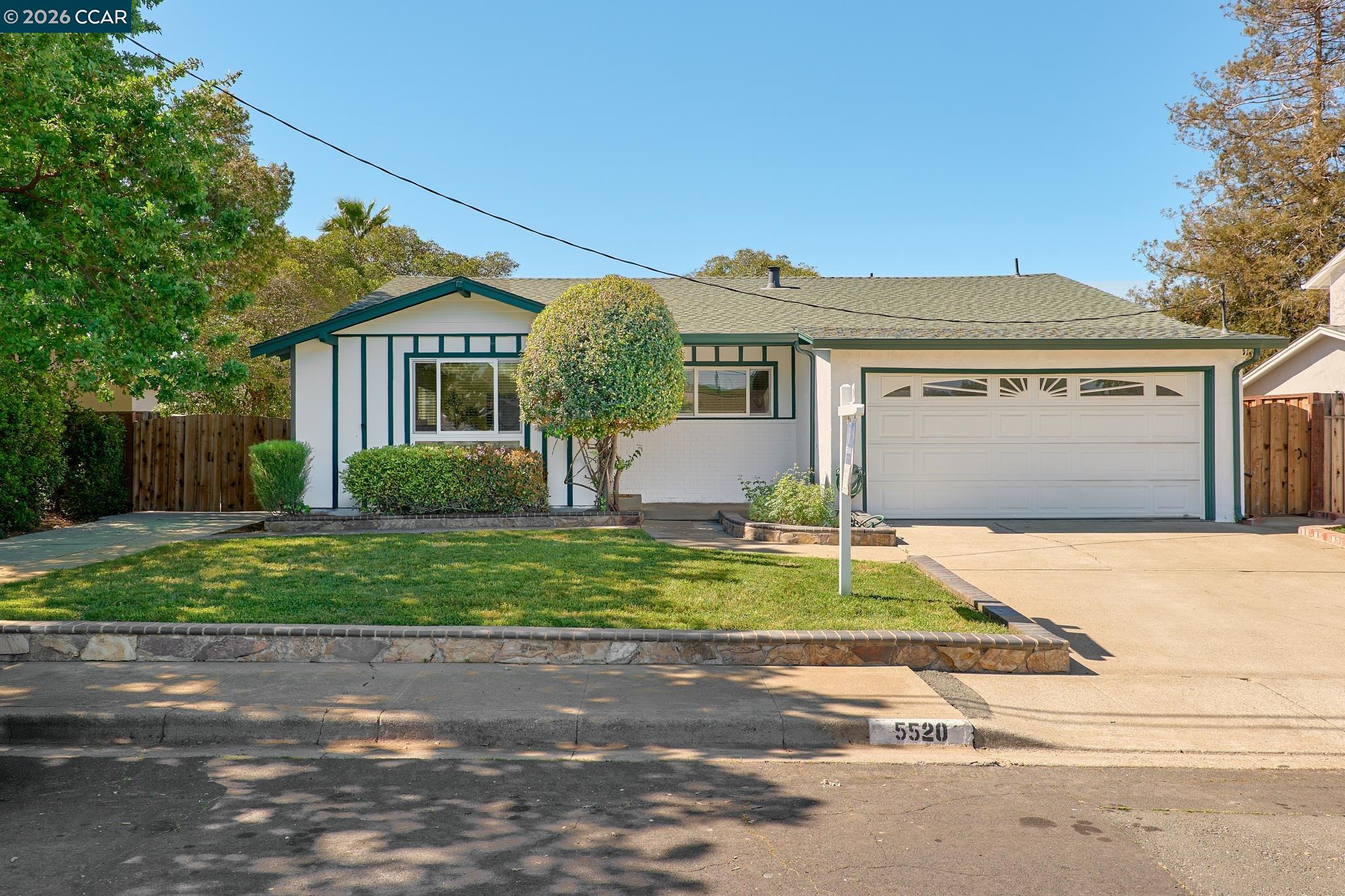5520 Alaska Drive Concord, CA 94521 - Photo 1 of 1 a front view of a house with a yard and garage