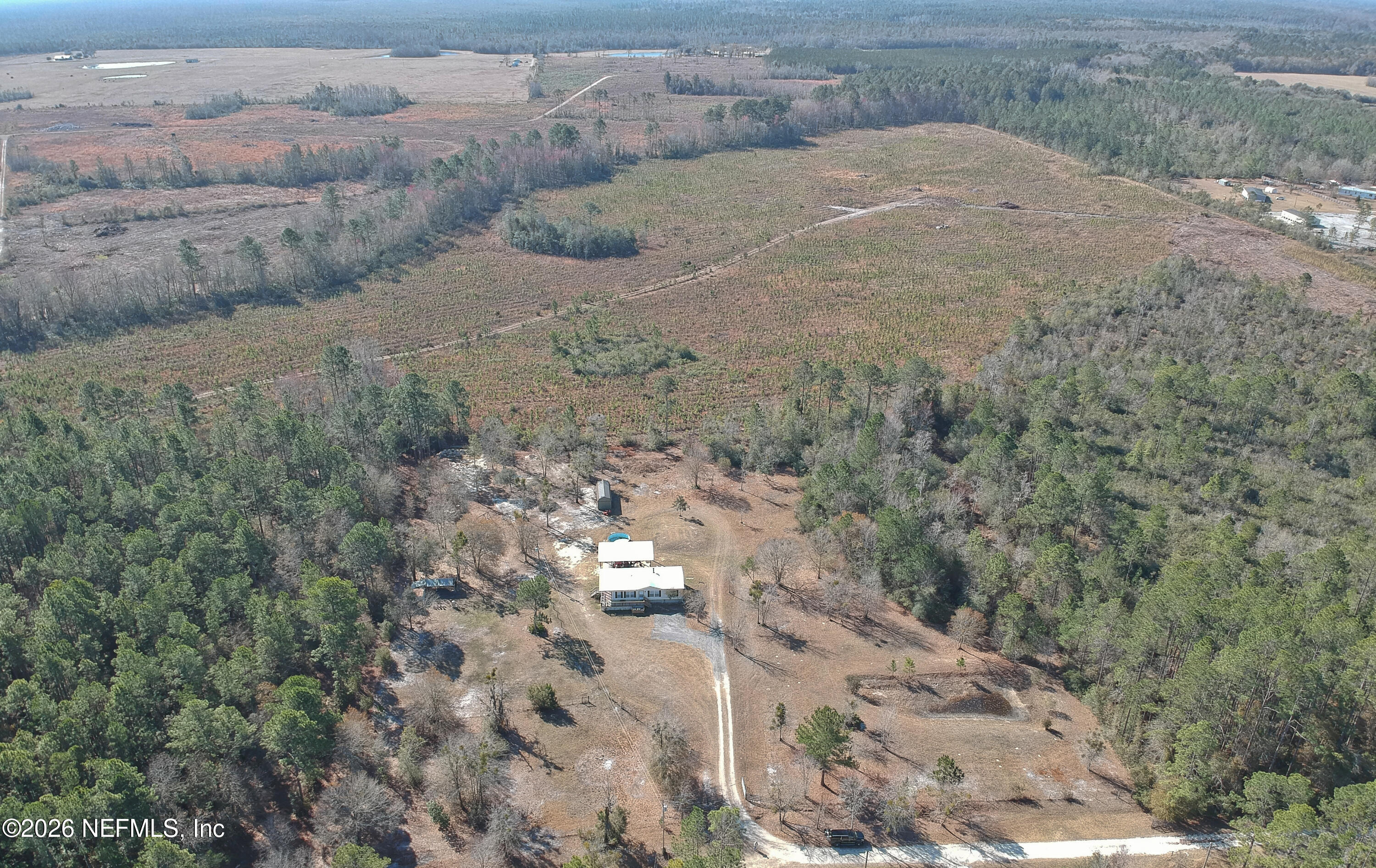 4680 Southeast 92nd Street Starke, FL 32091 - Photo 1 of 80 a view of a dry field with trees in background