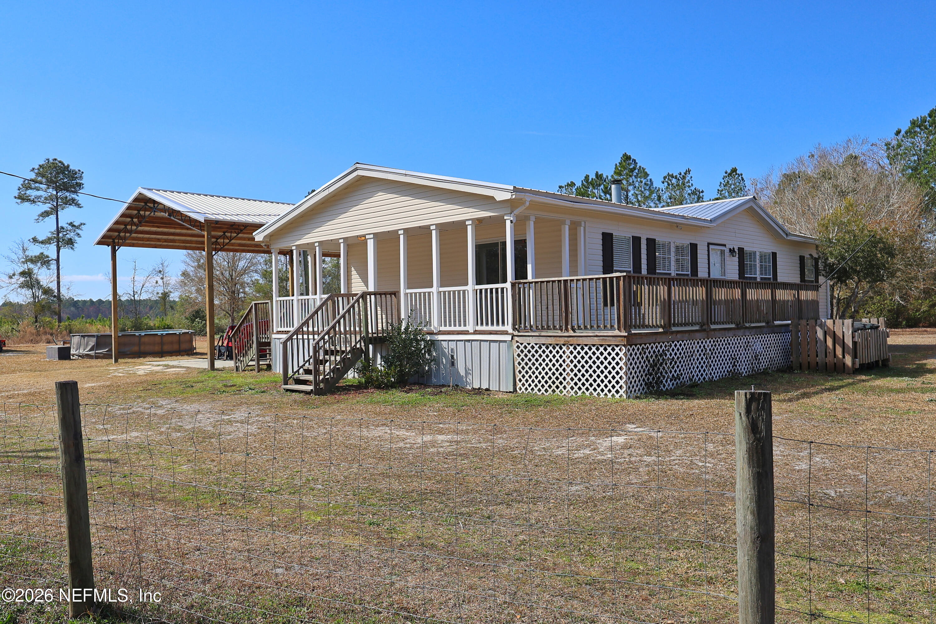 4680 Southeast 92nd Street Starke, FL 32091 - Photo 4 of 80 a view of a house with a yard balcony and chair