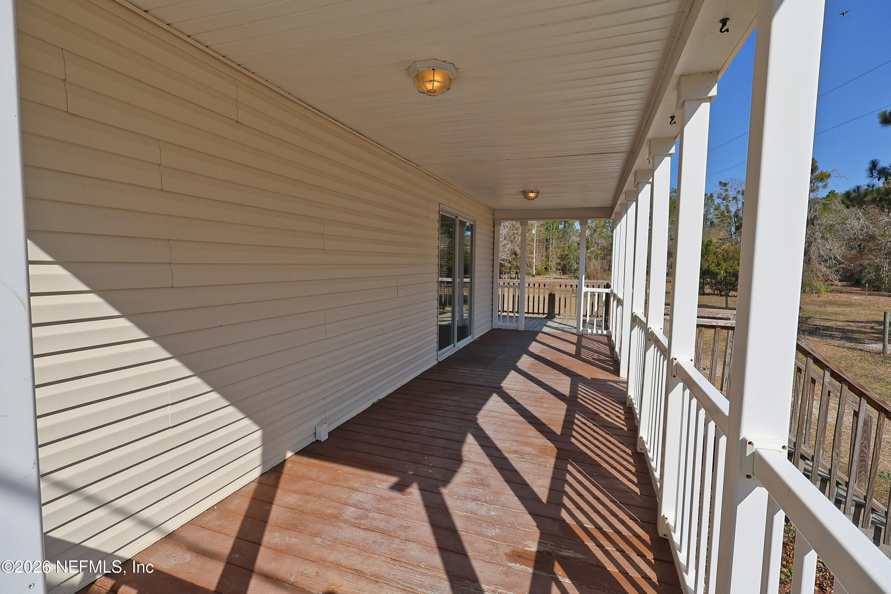 4680 Southeast 92nd Street Starke, FL 32091 - Photo 41 of 80 wrap around porch