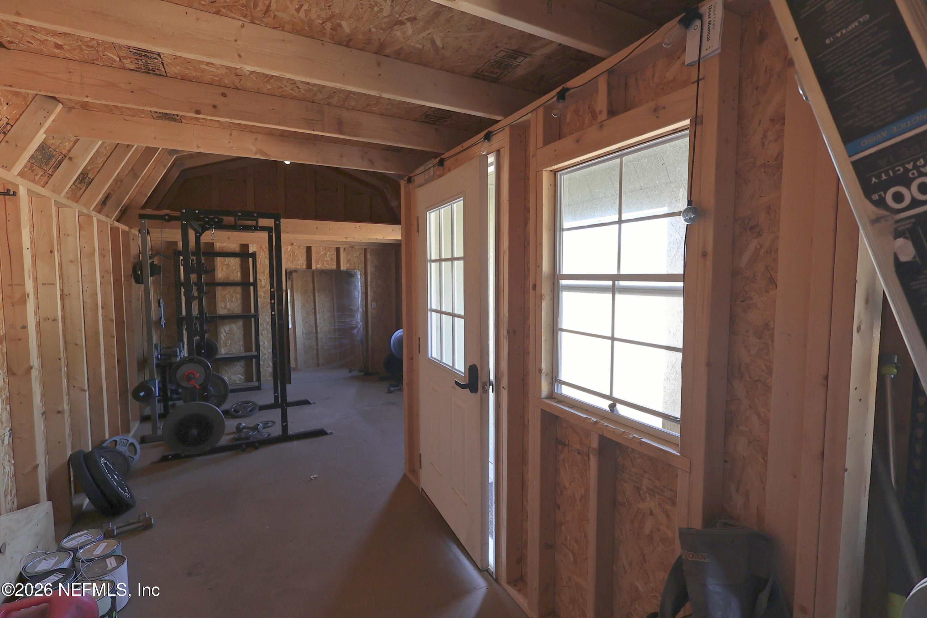 4680 Southeast 92nd Street Starke, FL 32091 - Photo 46 of 80 a view of a hallway with wooden floor and windows