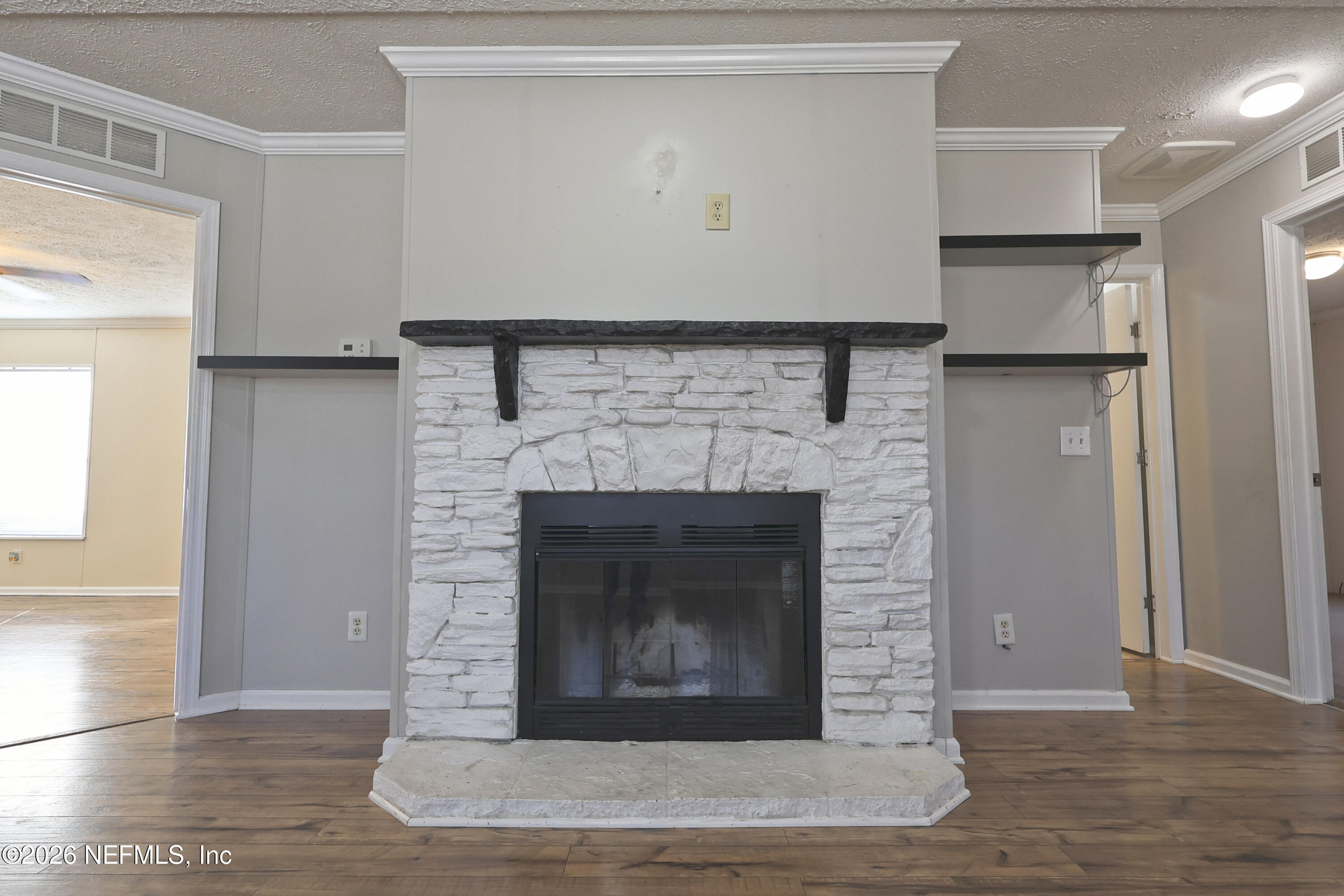4680 Southeast 92nd Street Starke, FL 32091 - Photo 10 of 80 a living room with a fireplace in it