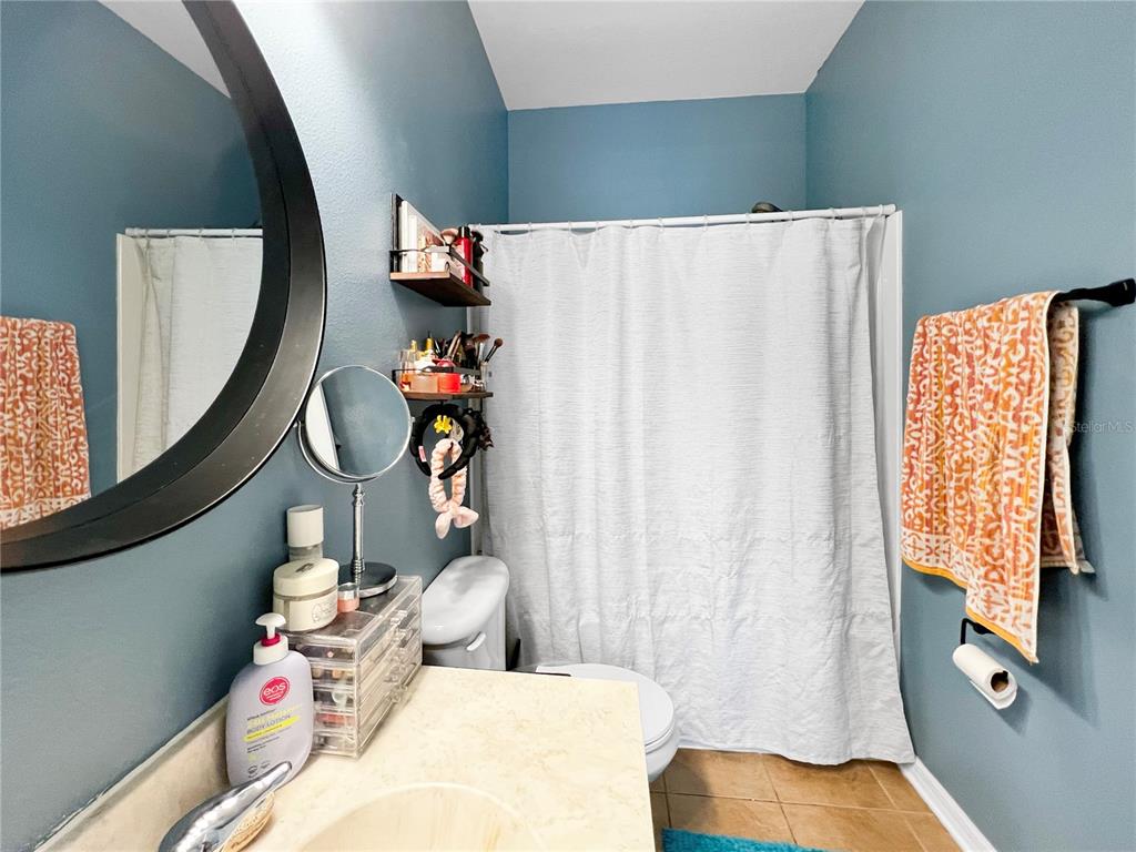 15767 Stable Run Drive Spring Hill, FL 34610 - Photo 25 of 34 a bedroom with bed and a mirror