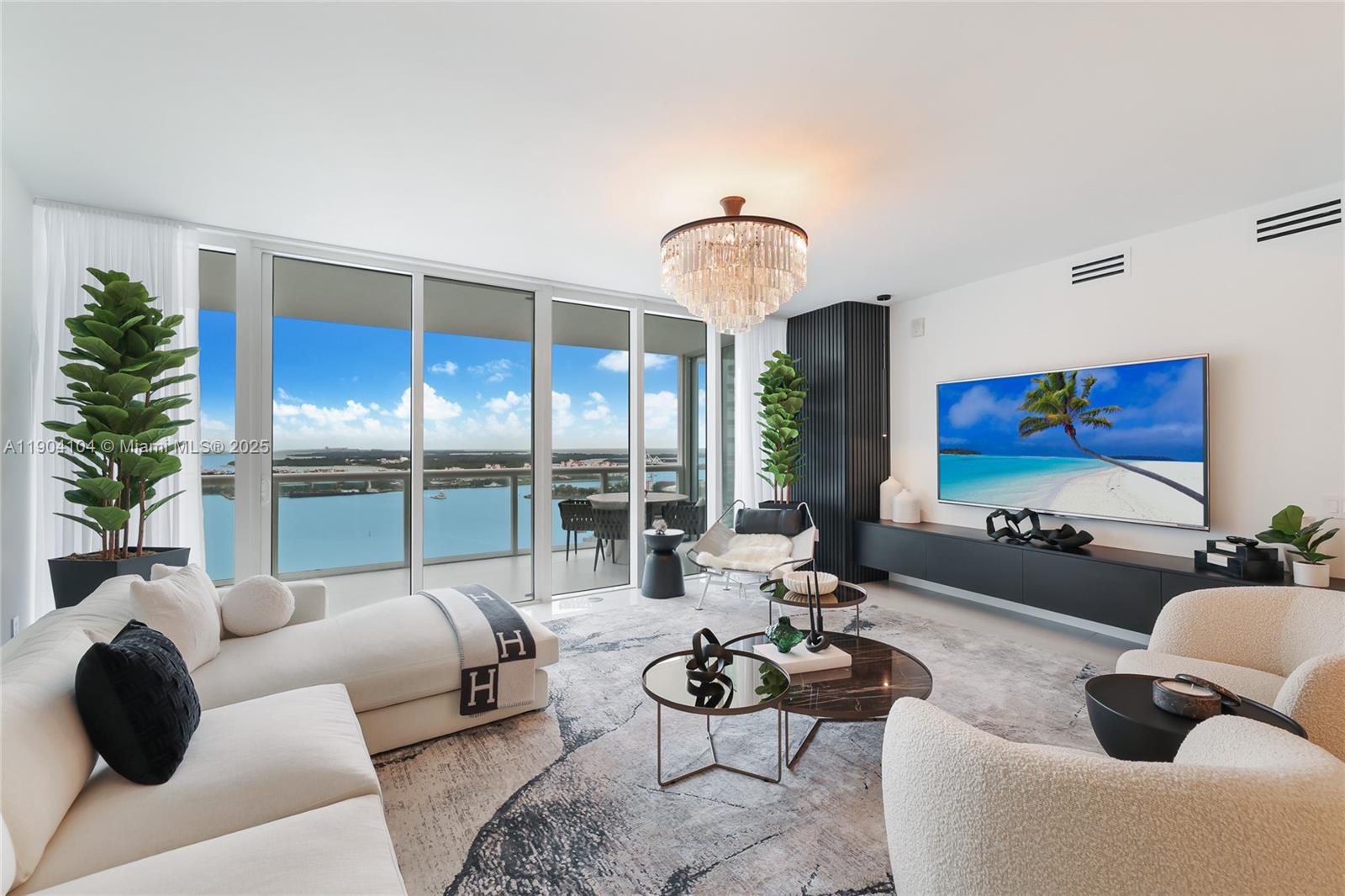450 Alton Road, Unit 2603 Miami Beach, FL 33139 - Photo 12 of 64 a living room with furniture and a large window