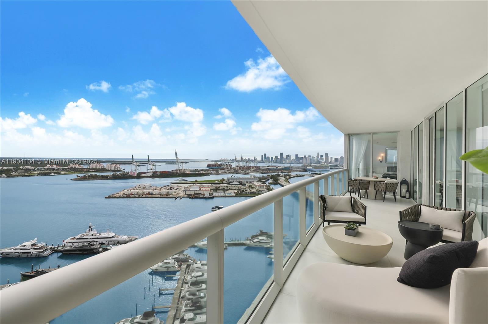 450 Alton Road, Unit 2603 Miami Beach, FL 33139 - Photo 16 of 64 a view of roof deck with furniture and ocean view