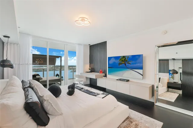 a bedroom with a bed and a mirror