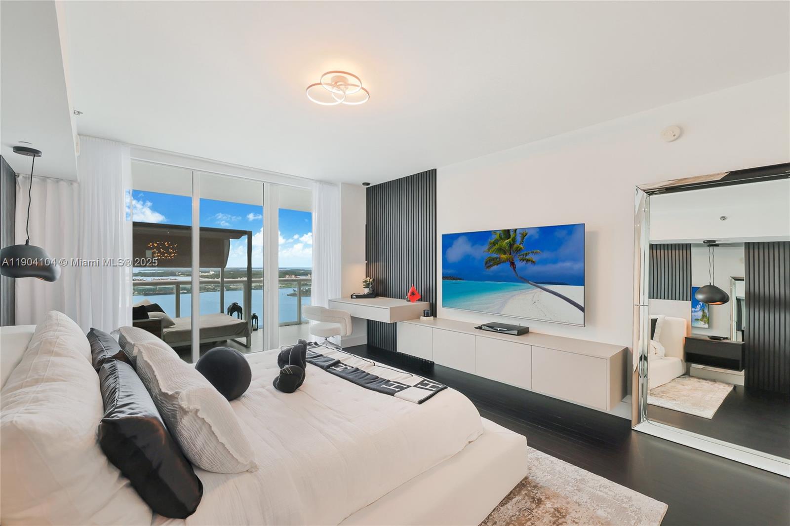 450 Alton Road, Unit 2603 Miami Beach, FL 33139 - Photo 19 of 64 a living room with furniture window and wooden floor