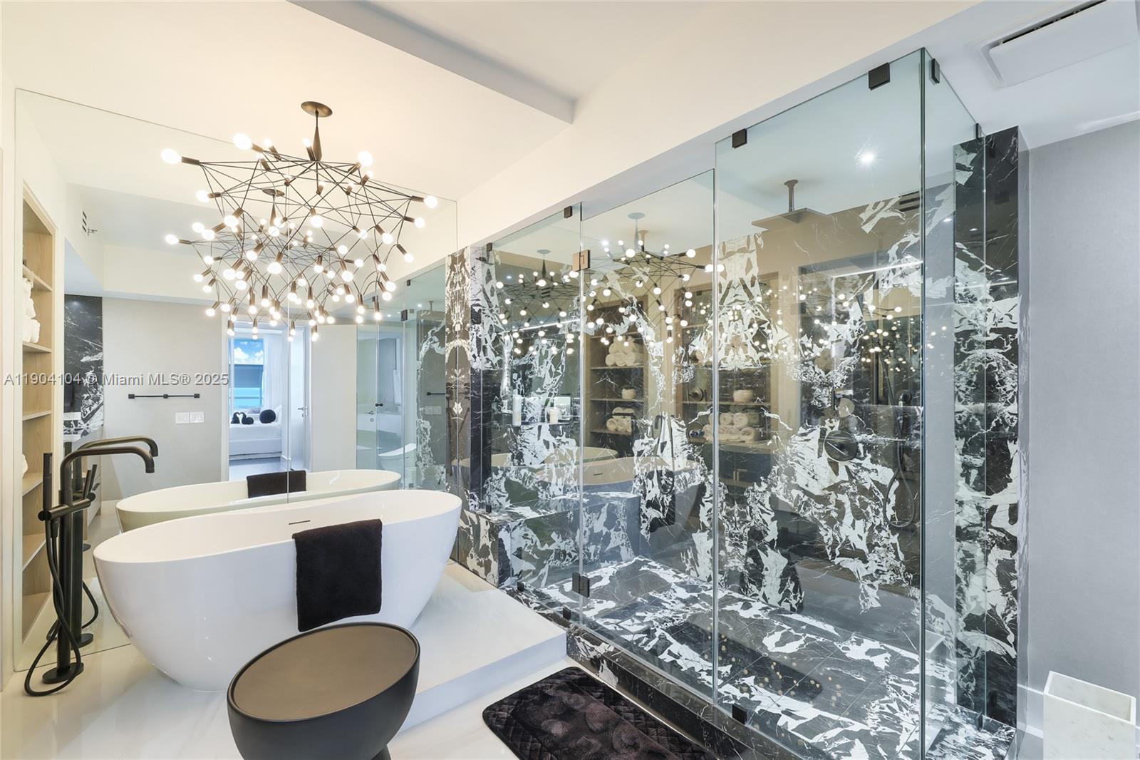 450 Alton Road, Unit 2603 Miami Beach, FL 33139 - Photo 20 of 64 a very nice looking room with a large window and chandelier