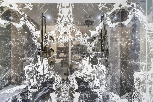 a bedroom with a bed and large window with balcony view