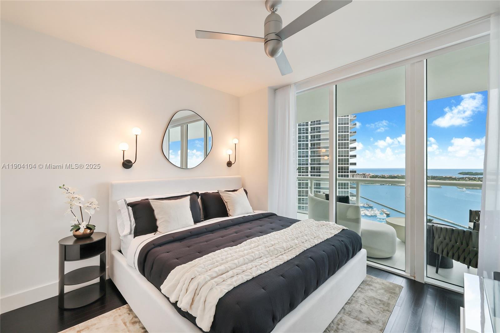 450 Alton Road, Unit 2603 Miami Beach, FL 33139 - Photo 23 of 64 a bedroom with a bed and a large window