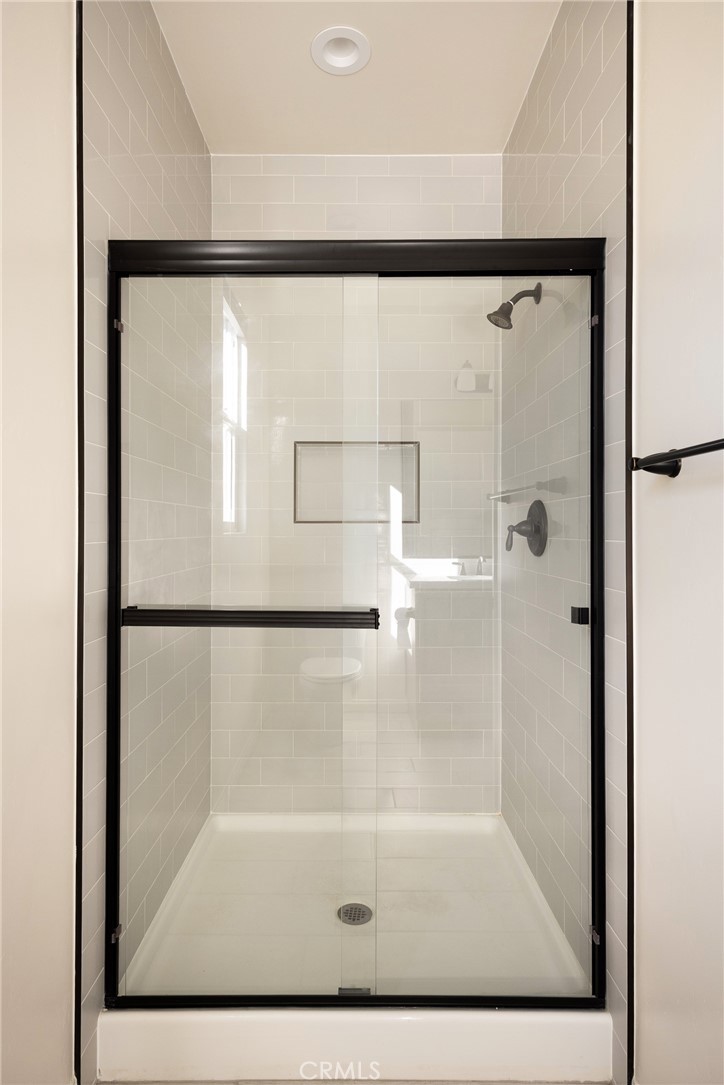3940 Righetti Ranch Road San Luis Obispo, CA 93401 - Photo 14 of 18 a bathroom with a glass shower door