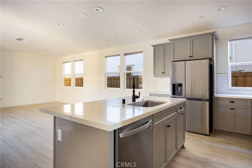 3940 Righetti Ranch Road San Luis Obispo, CA 93401 - Photo 2 of 18 a kitchen that has a sink and a refrigerator