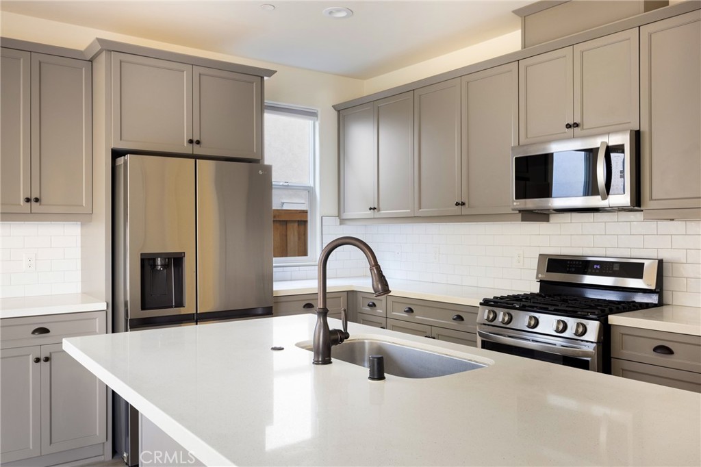 3940 Righetti Ranch Road San Luis Obispo, CA 93401 - Photo 3 of 18 a kitchen with stainless steel appliances a refrigerator sink and cabinets