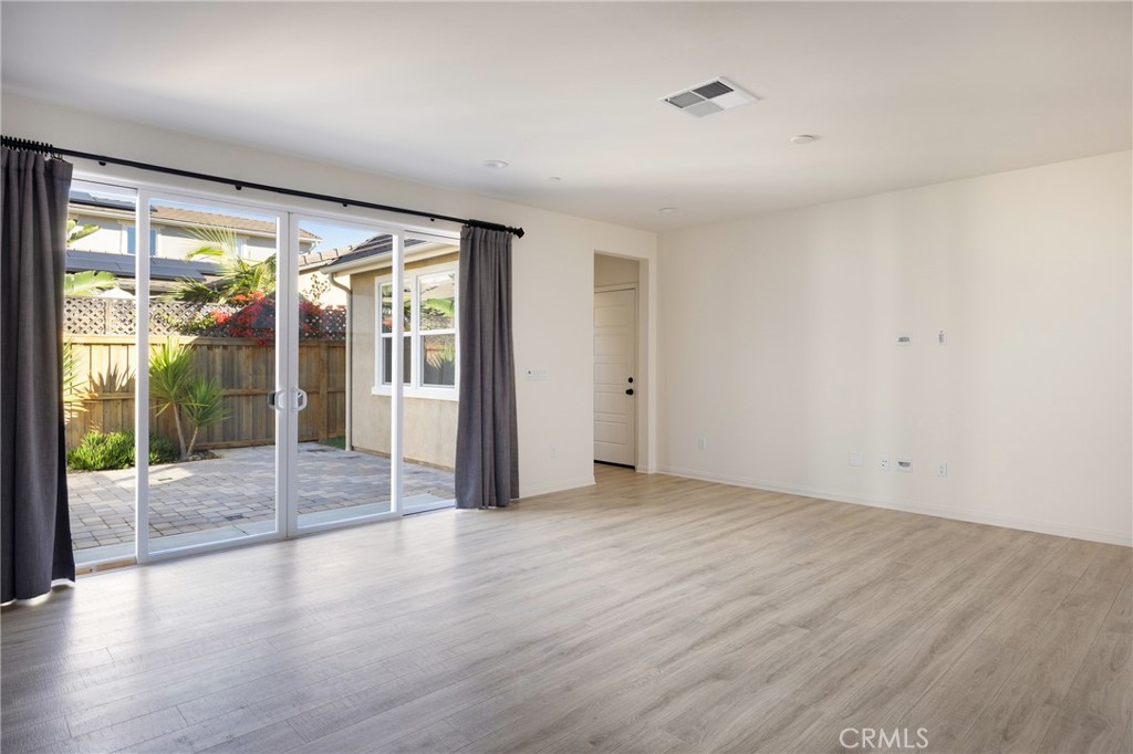 3940 Righetti Ranch Road San Luis Obispo, CA 93401 - Photo 5 of 18 a view of an empty room with wooden floor