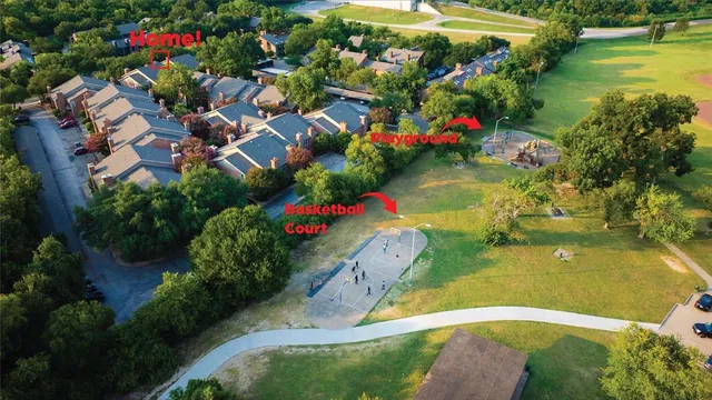 a view of a lake with a flower garden