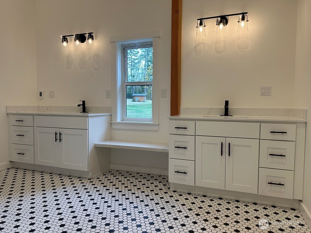 24345 Wax Orchard Road Southwest Vashon, WA 98070 - Photo 13 of 17 a bathroom with a sink a vanity and a mirror