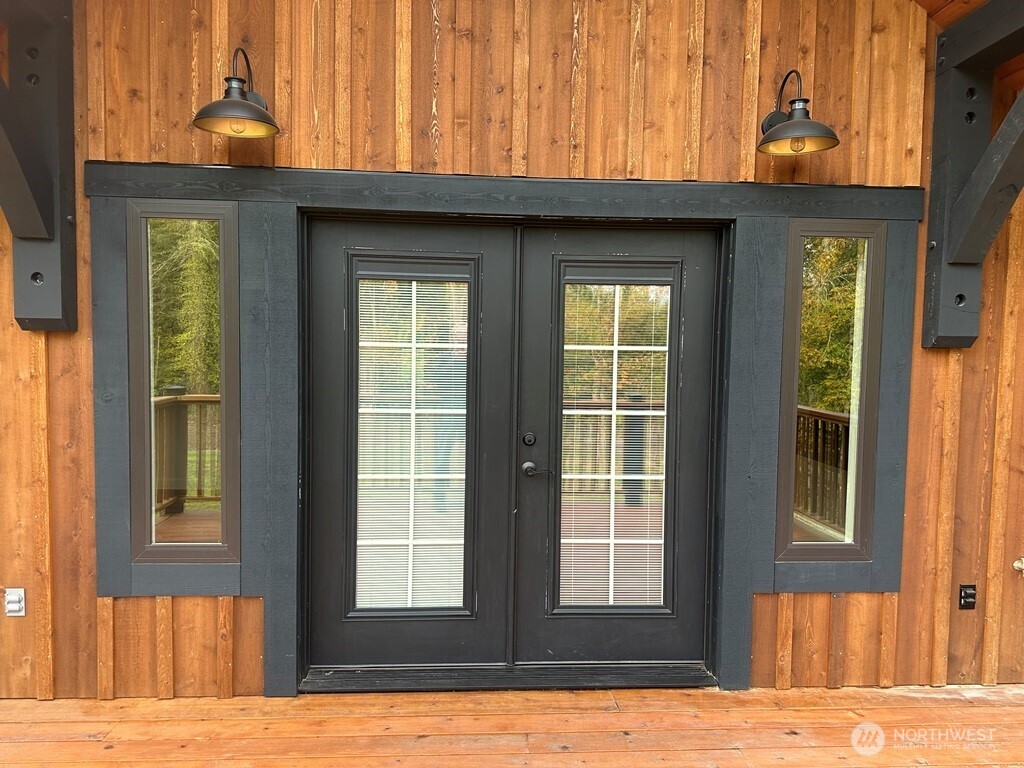 24345 Wax Orchard Road Southwest Vashon, WA 98070 - Photo 3 of 17 a view of front door with yard
