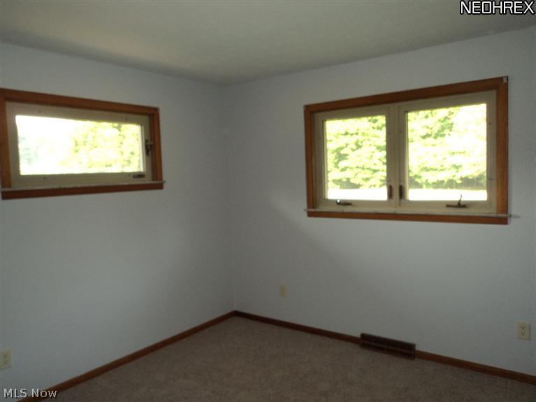 5690 Beach Road Medina, OH 44256 - Photo 10 of 14 OWNERS SUITE WITH NEW CARPET, DOUBLE CLOSETS AND PLENTY OF WINDOWS. BATH INCLUDES SHOWER WITH CULTURED MARBLE SHOWER INSERT, SINGLE SINK WITH NEW VANITY AND NEW FLOOR.