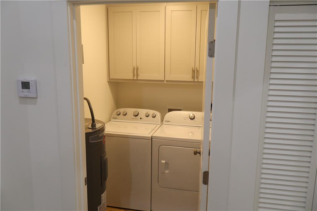 5120 Railroad Avenue Flowery Branch, GA 30542 - Photo 12 of 34 a utility room with dryer and washer