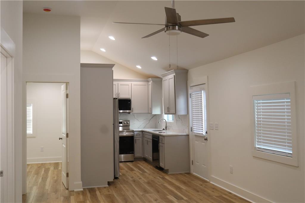 5120 Railroad Avenue Flowery Branch, GA 30542 - Photo 13 of 34 a view of a kitchen with a sink cabinets and stainless steel appliances