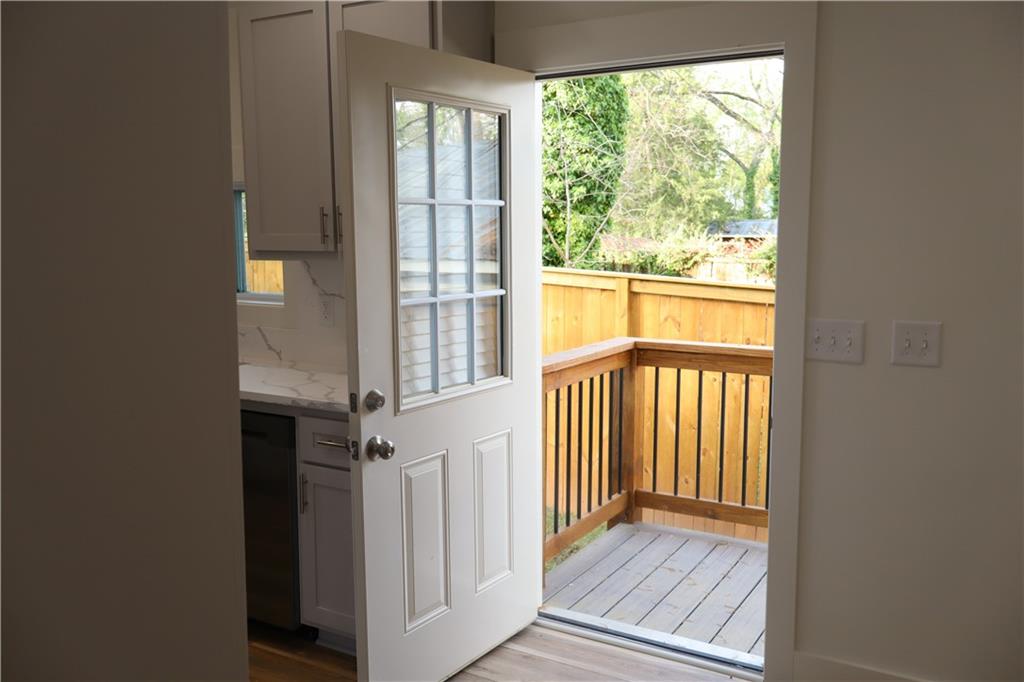 5120 Railroad Avenue Flowery Branch, GA 30542 - Photo 20 of 34 a view of a hallway with wooden floor and stairs