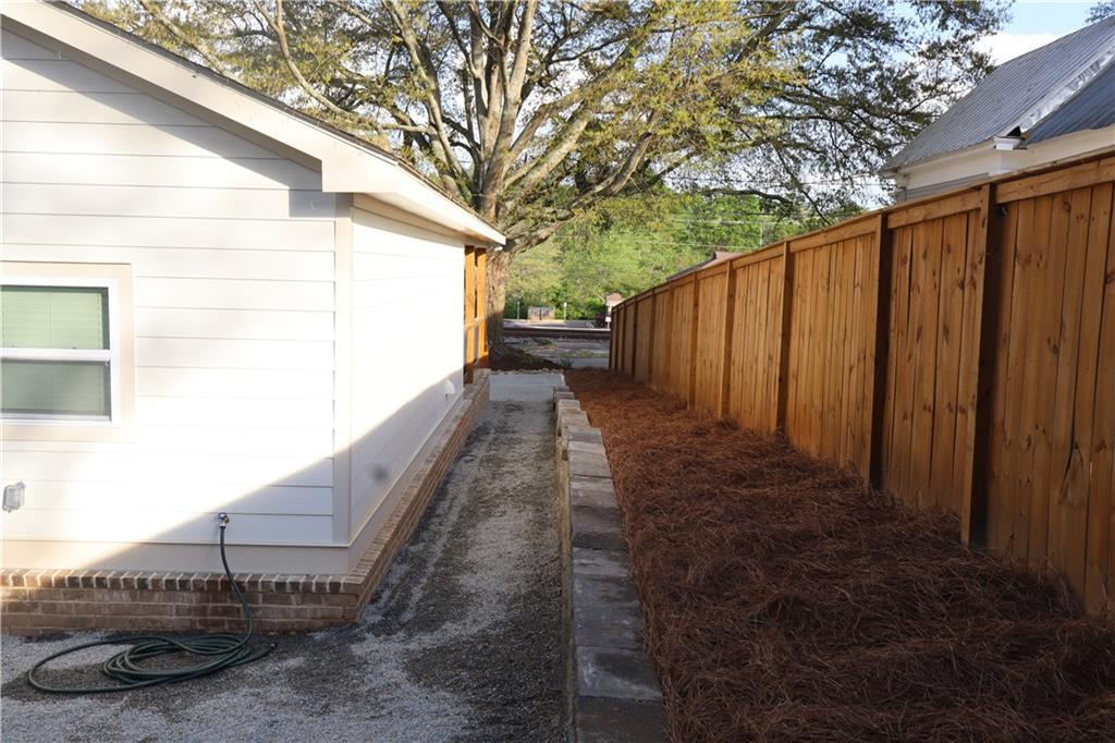 5120 Railroad Avenue Flowery Branch, GA 30542 - Photo 22 of 34 a view of a backyard with pathway