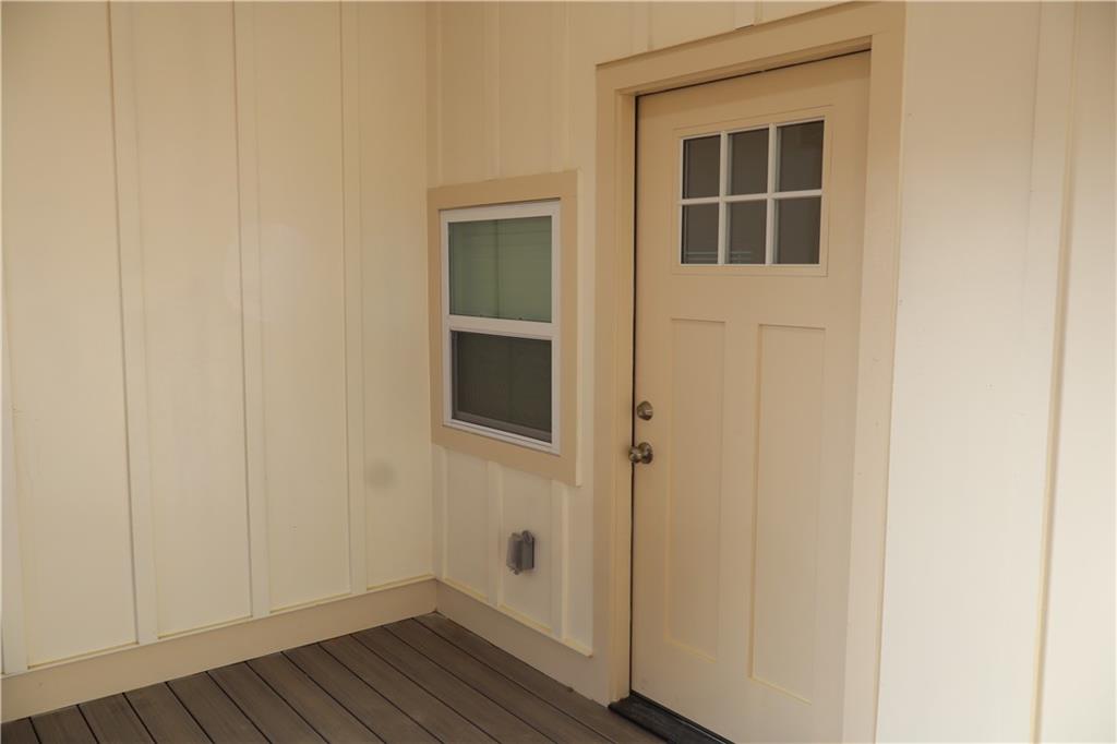 5120 Railroad Avenue Flowery Branch, GA 30542 - Photo 4 of 34 a view of empty room with wooden floor and entryway