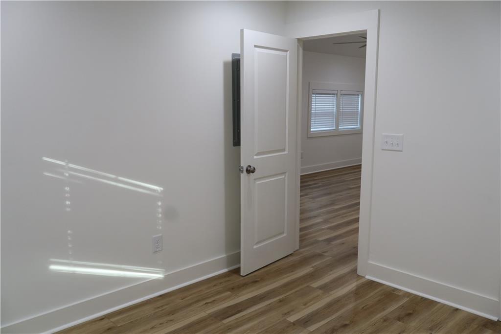 5120 Railroad Avenue Flowery Branch, GA 30542 - Photo 7 of 34 wooden floor in an empty room
