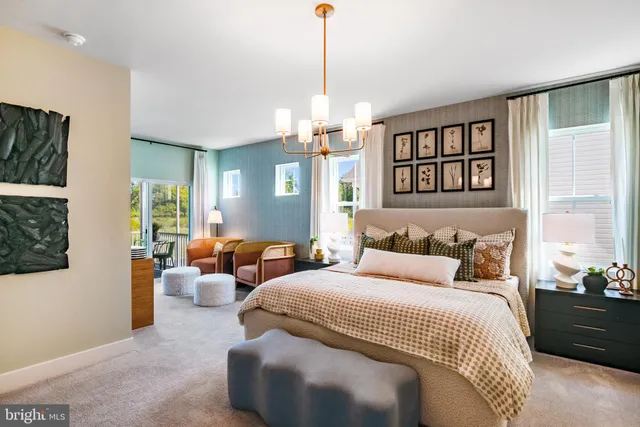 a bedroom with bed window and couch