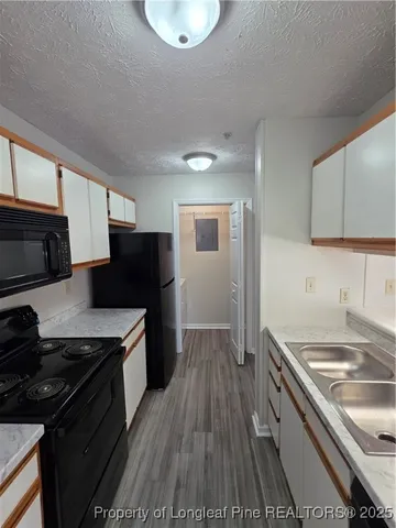 a kitchen with a stove and a refrigerator