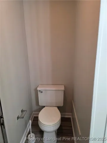 a white toilet sitting in a bathroom