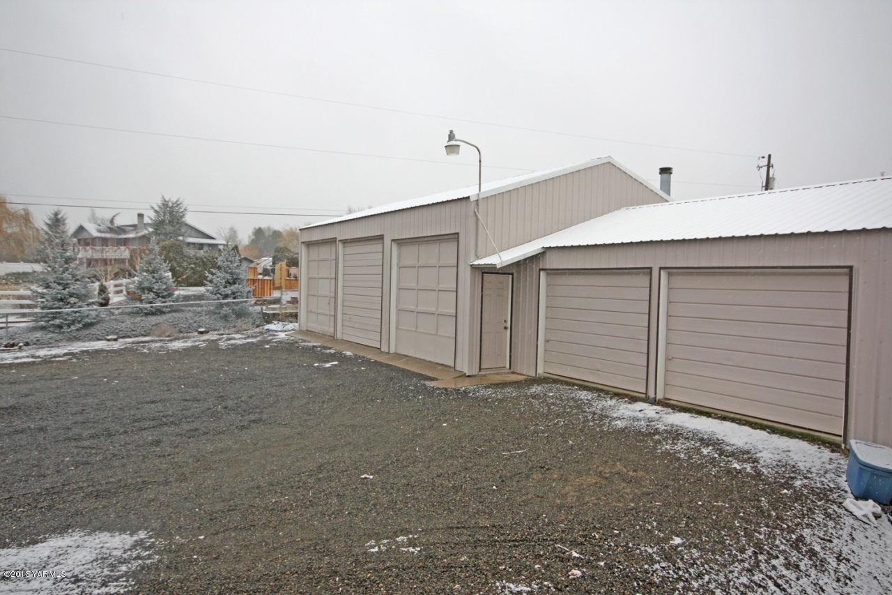 7303 Bittner Road Yakima, WA 98901 - Photo 6 of 38 a view of a house with a garage