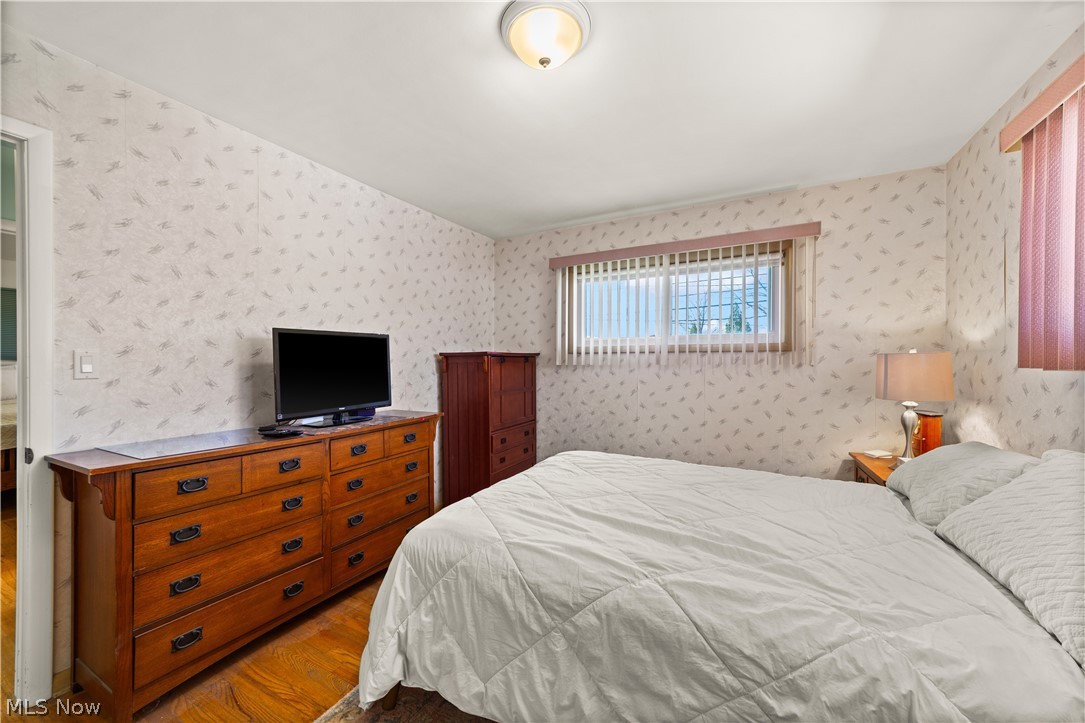 1730 Alcester Road Mayfield Heights, OH 44124 - Photo 14 of 39 Bedroom with dark wood finished floors